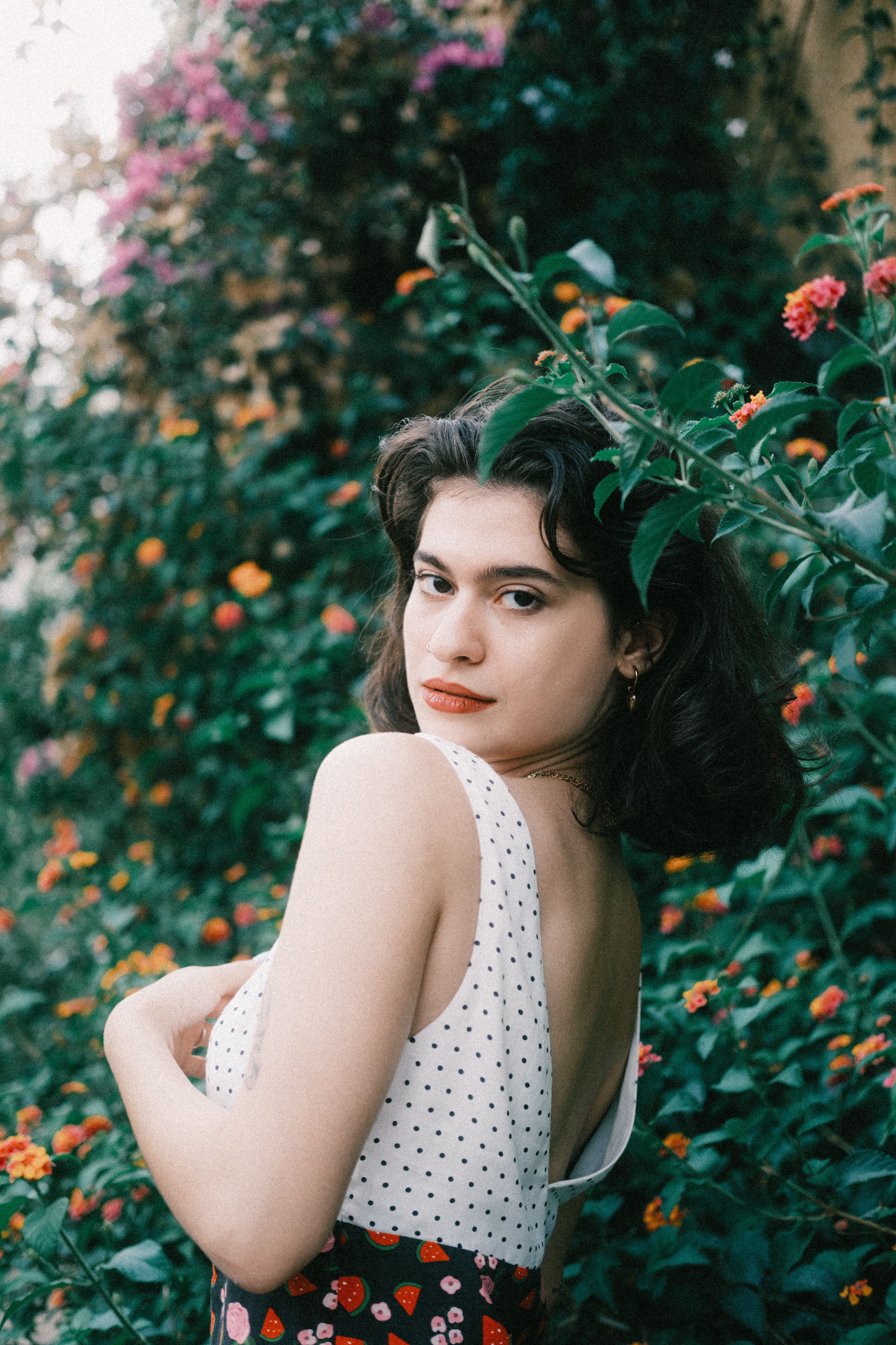 Portrait of Woman in Floral Garden Setting · Free Stock Photo