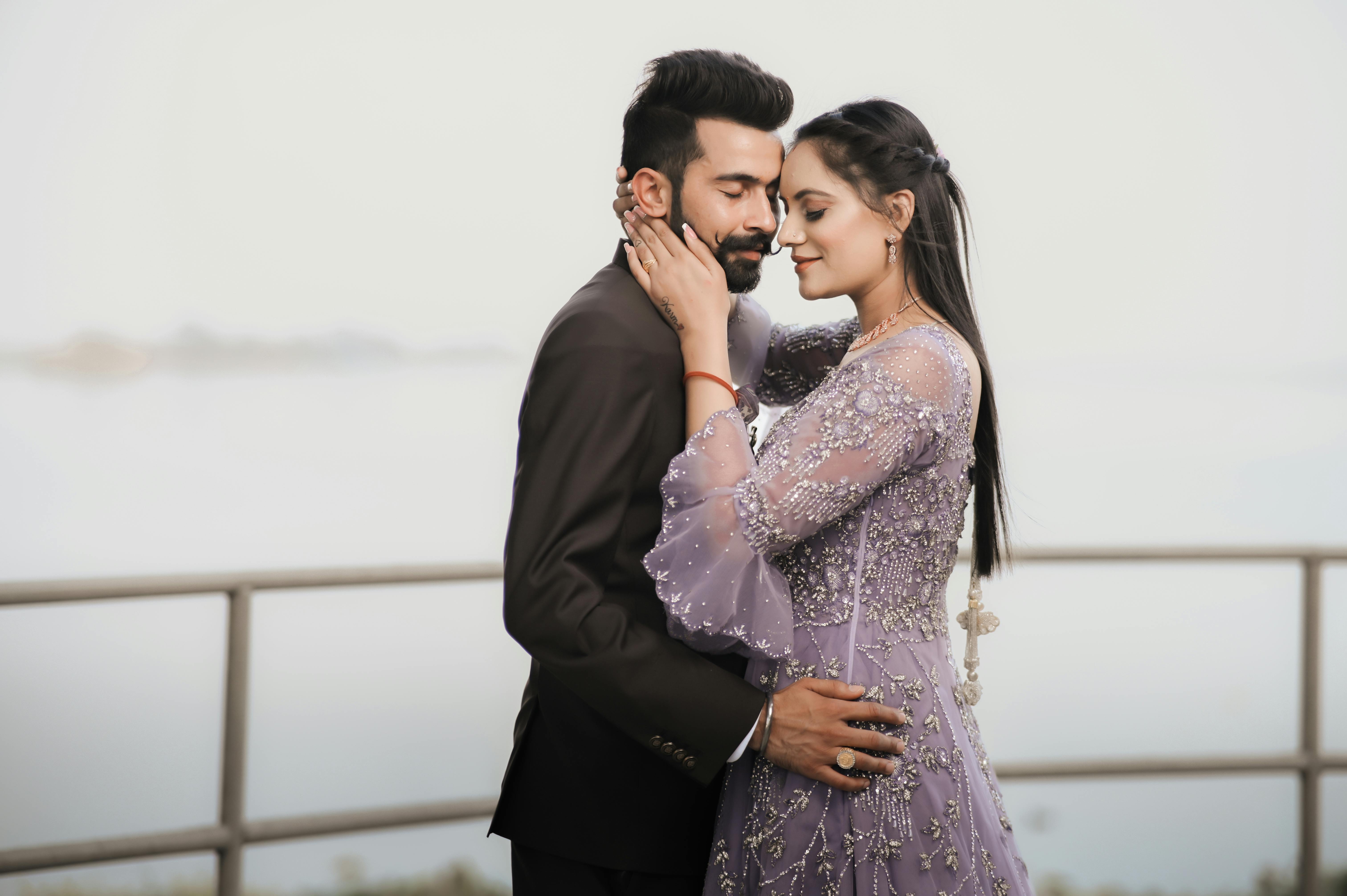 romantic couple embracing by the lakeside