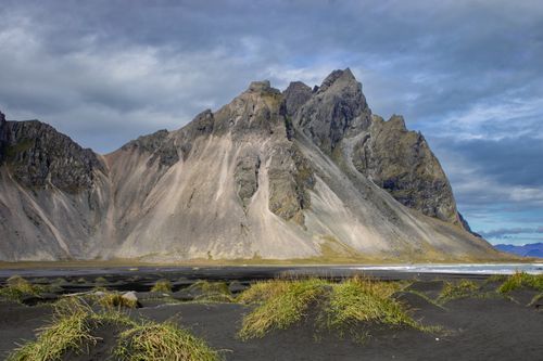 Free Stunning view of Vestrahorn Mountain with black sand beaches and dramatic skies in Iceland. Stock Photo