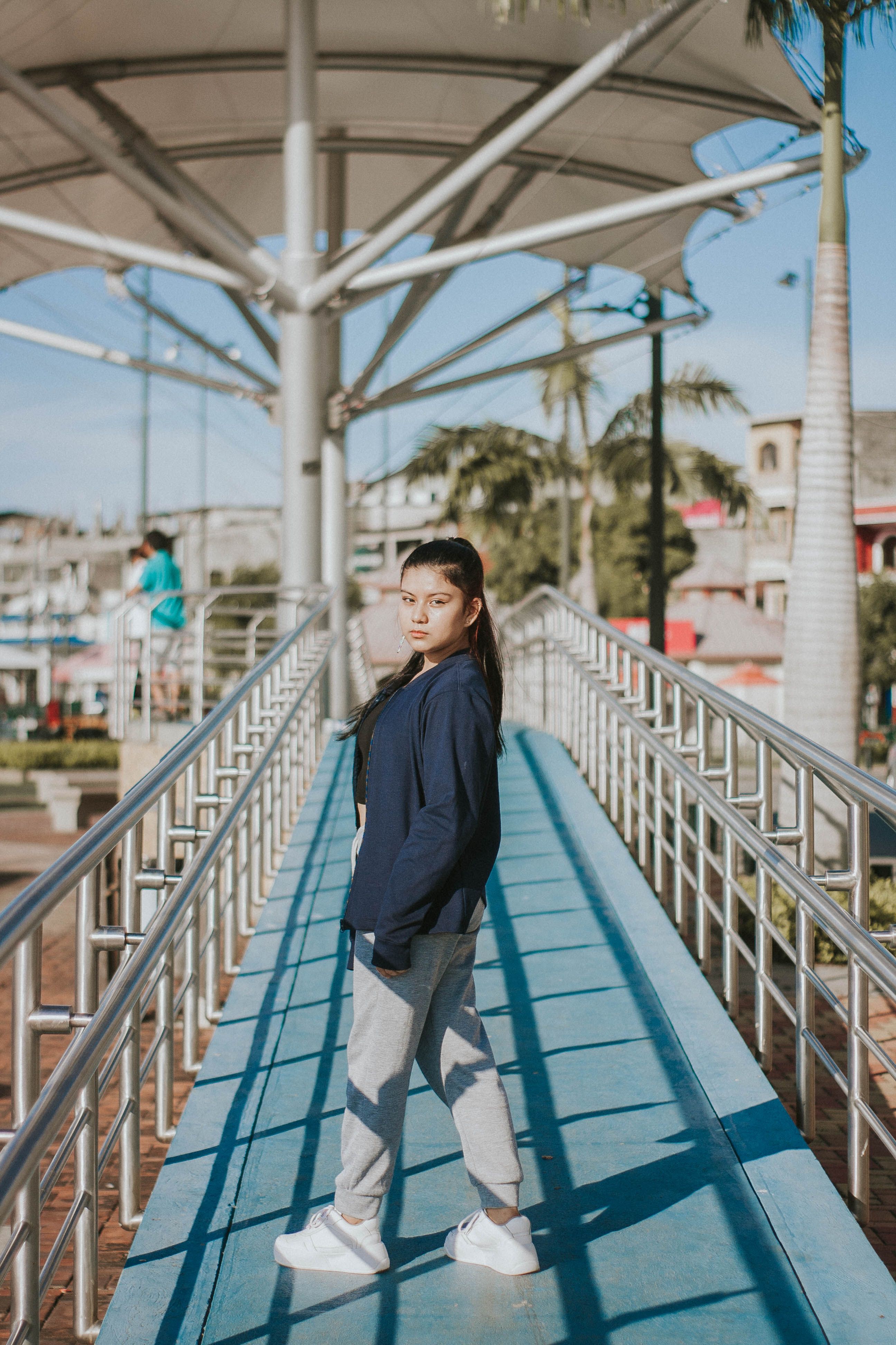 Teen Posing on Modern Bridge Outdoors · Free Stock Photo