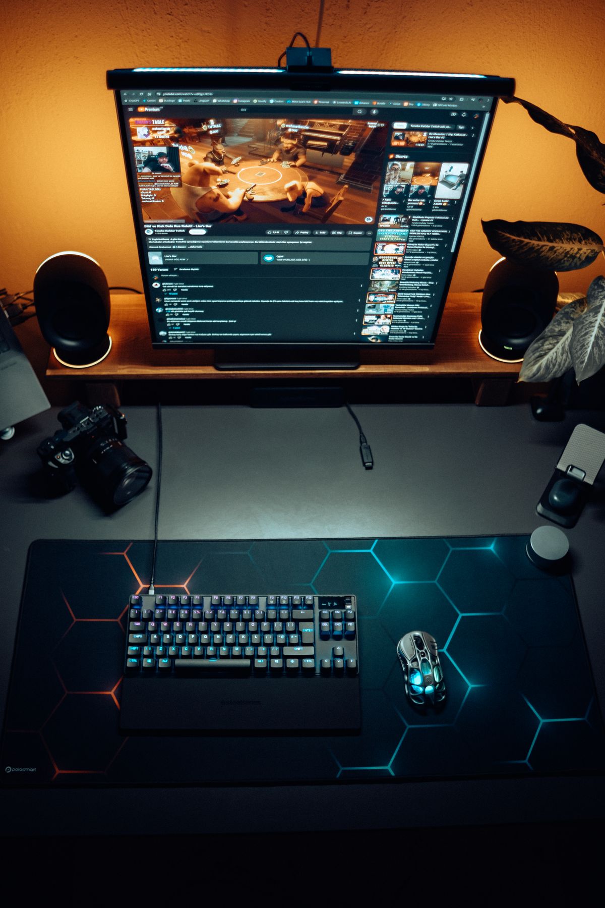 Modern gaming setup with RGB keyboard and mouse under ambient lighting