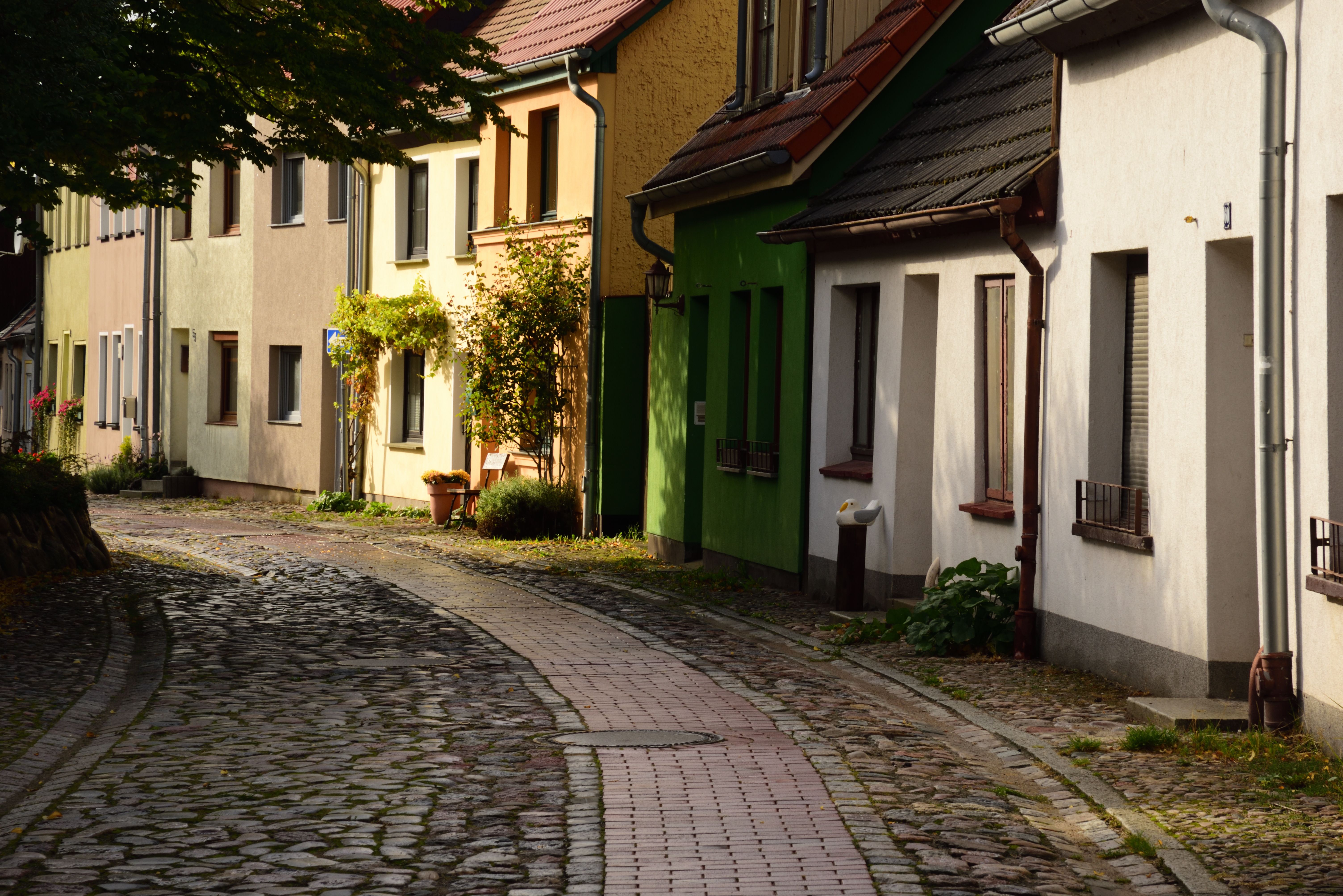 Brick-paved street lined with nineteenth-century brick cottages in German Village, Columbus