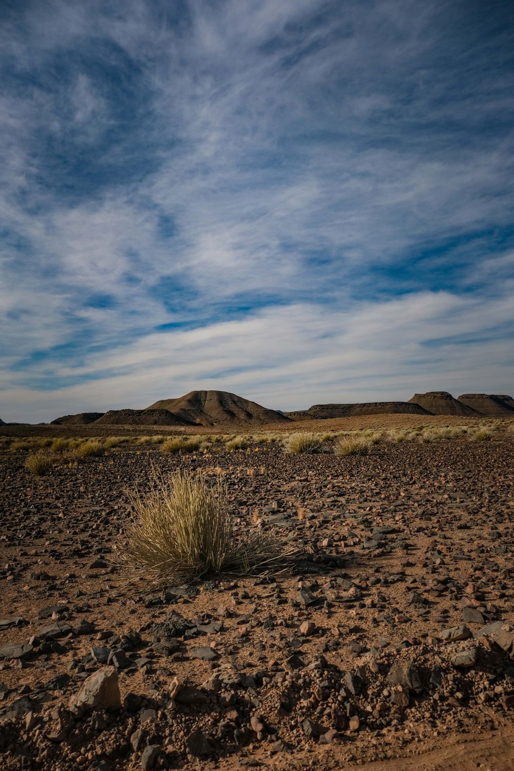 Desert landscape with rocky terrain and sky · Free Stock Photo
