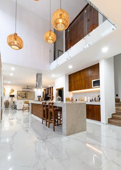 Sleek modern studio apartment with stylish kitchen and lighting.