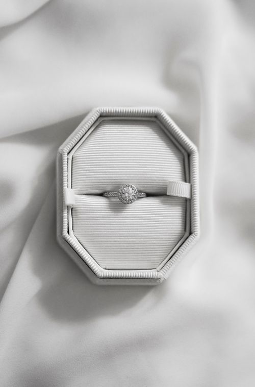 Free A beautiful, sparkling engagement ring in an elegant octagonal box on soft fabric. Stock Photo