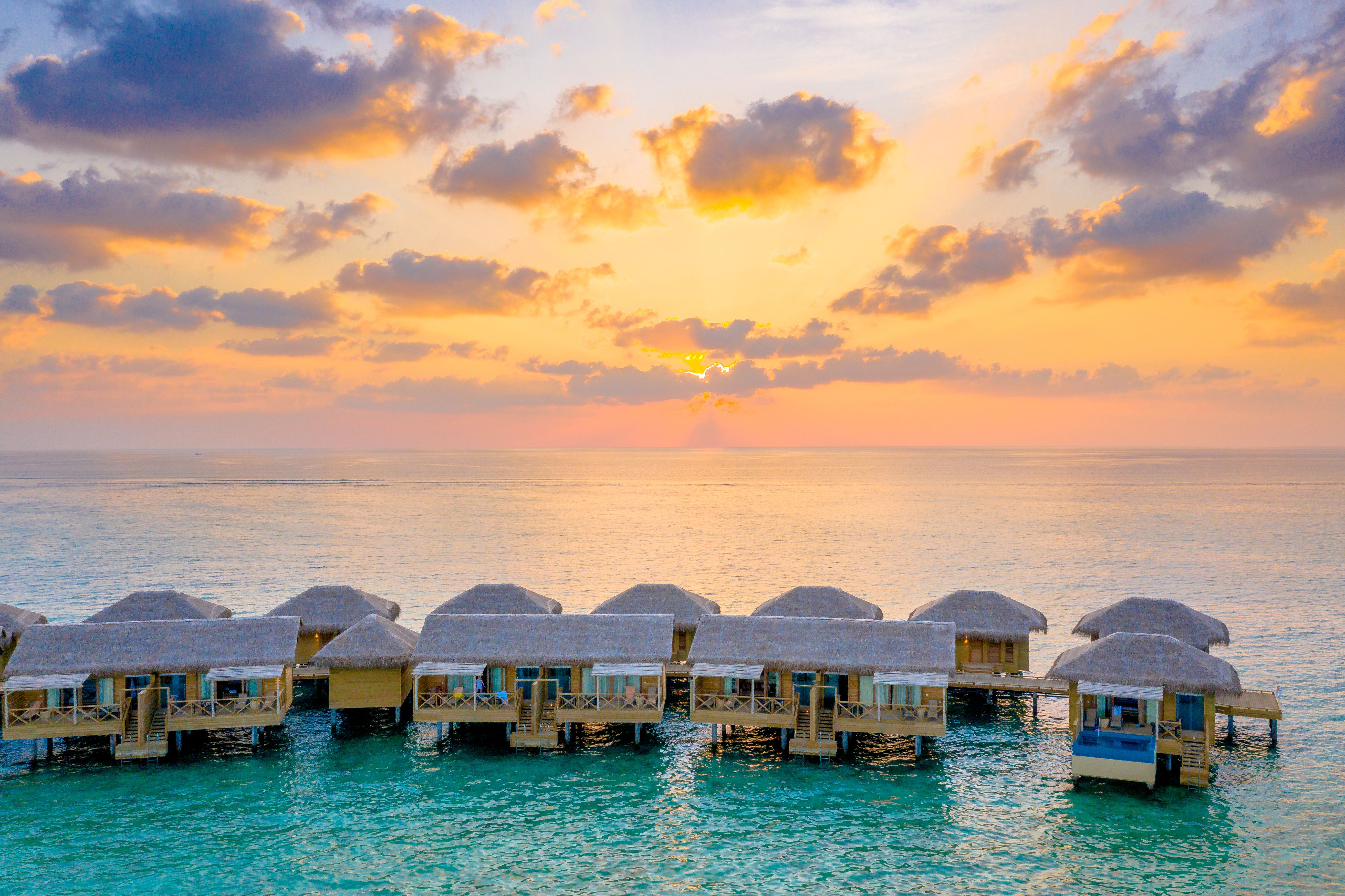 Sunset overwater bungalow Maldives