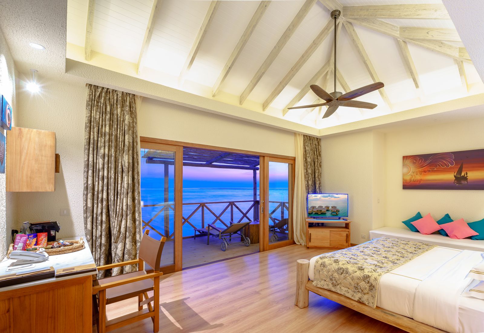 Romantic honeymoon suite with sunset beachfront ambiance