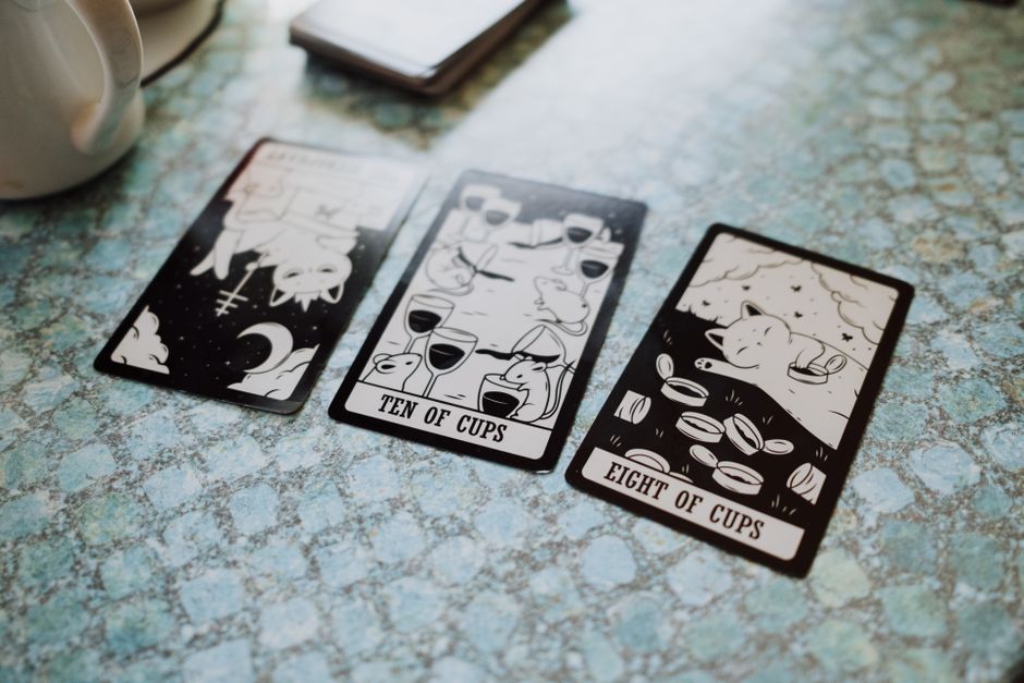 three tarot cards face up on table