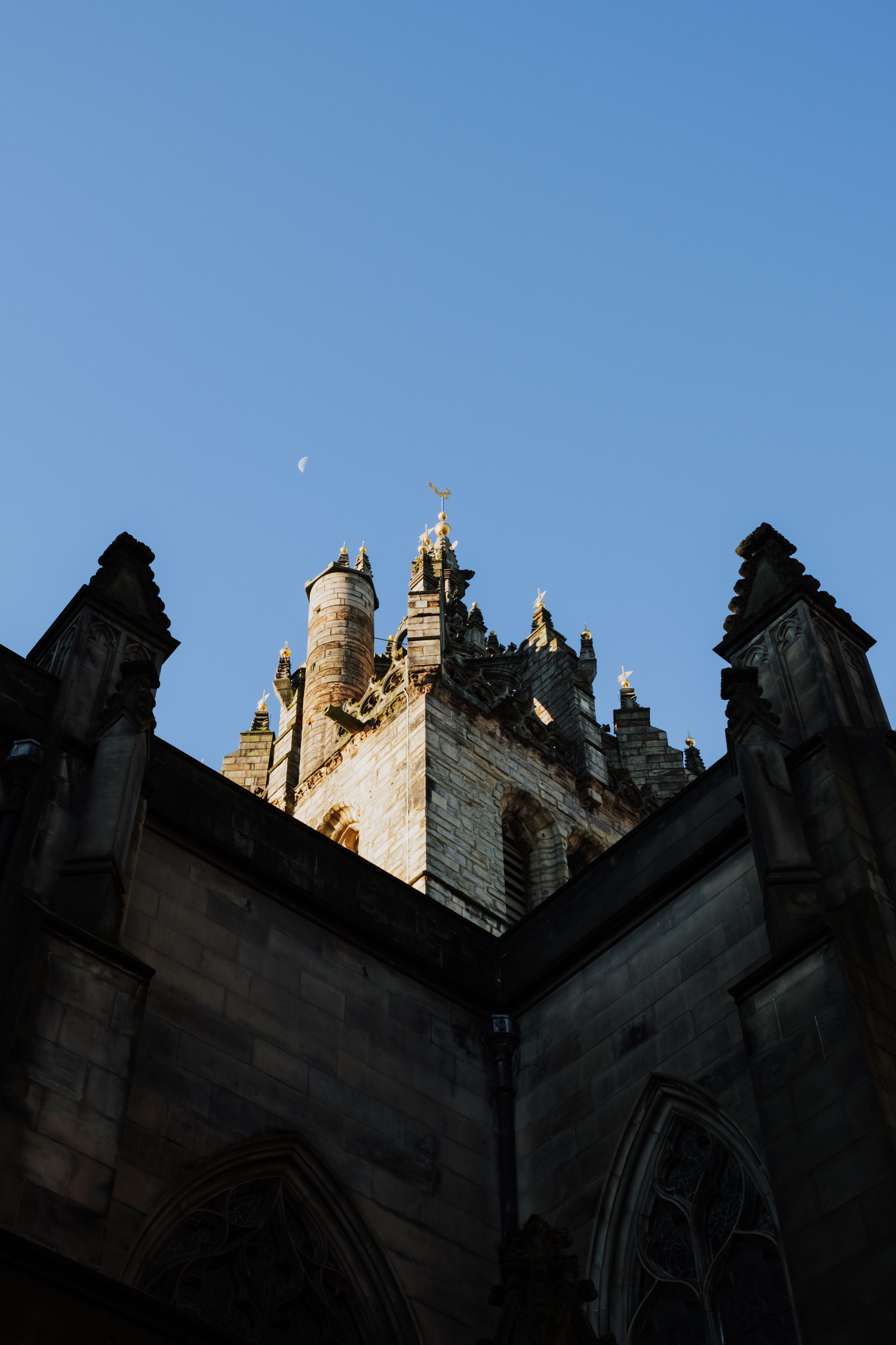 Historic Edinburgh Church Tower Under Blue Sky · Free Stock Photo