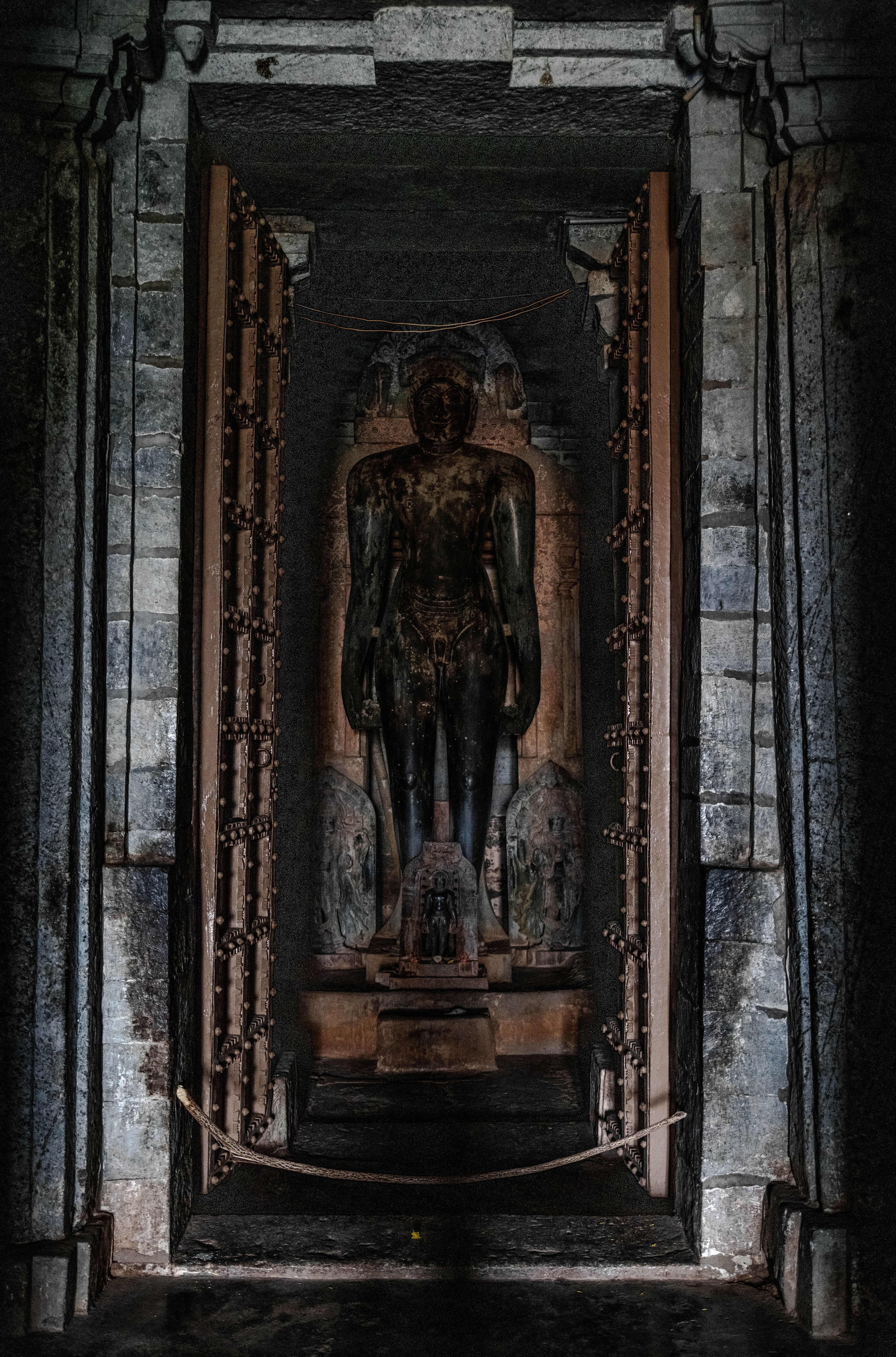Ancient Stone Sculpture in Dimly Lit Temple · Free Stock Photo