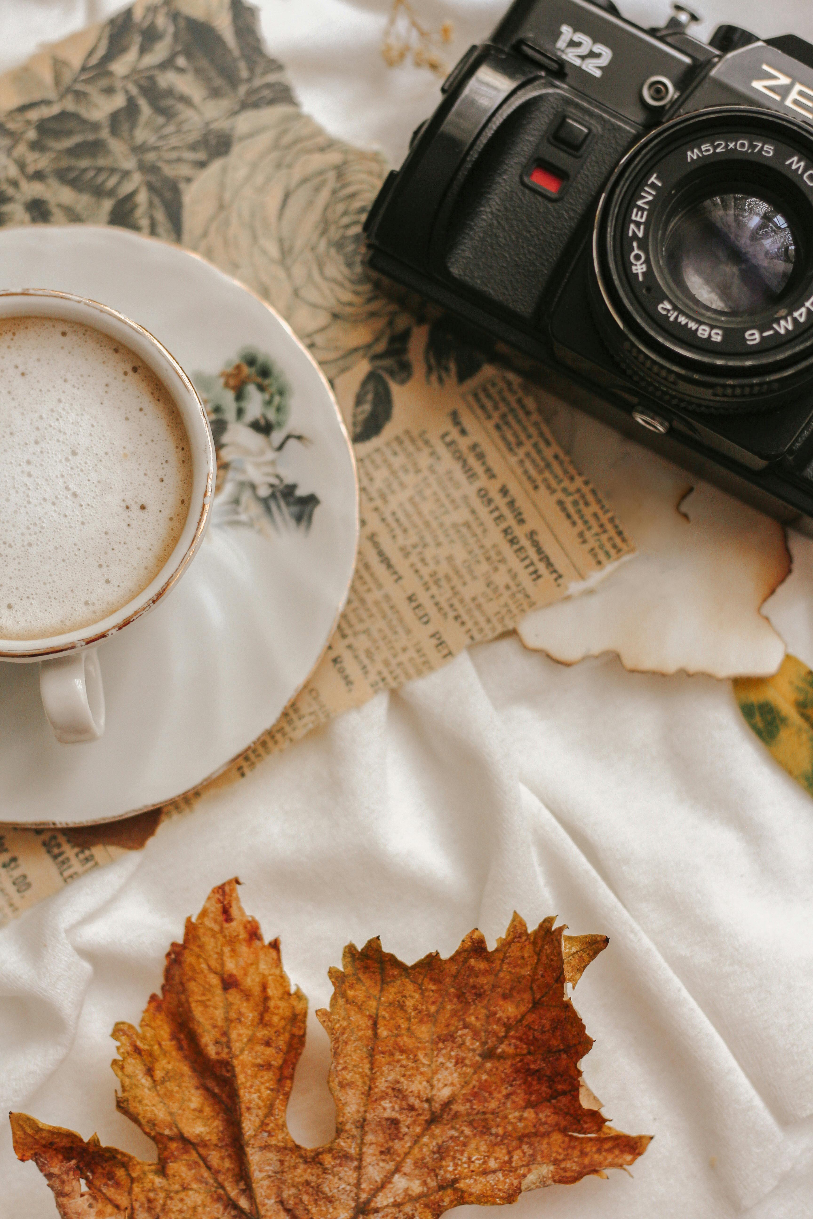 cozy autumn still life with coffee and camera