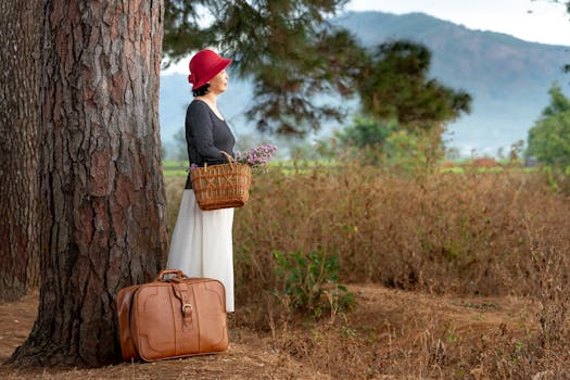 Asian woman with red hat and basket stands in scenic countryside, ideal for travel and nature themes.