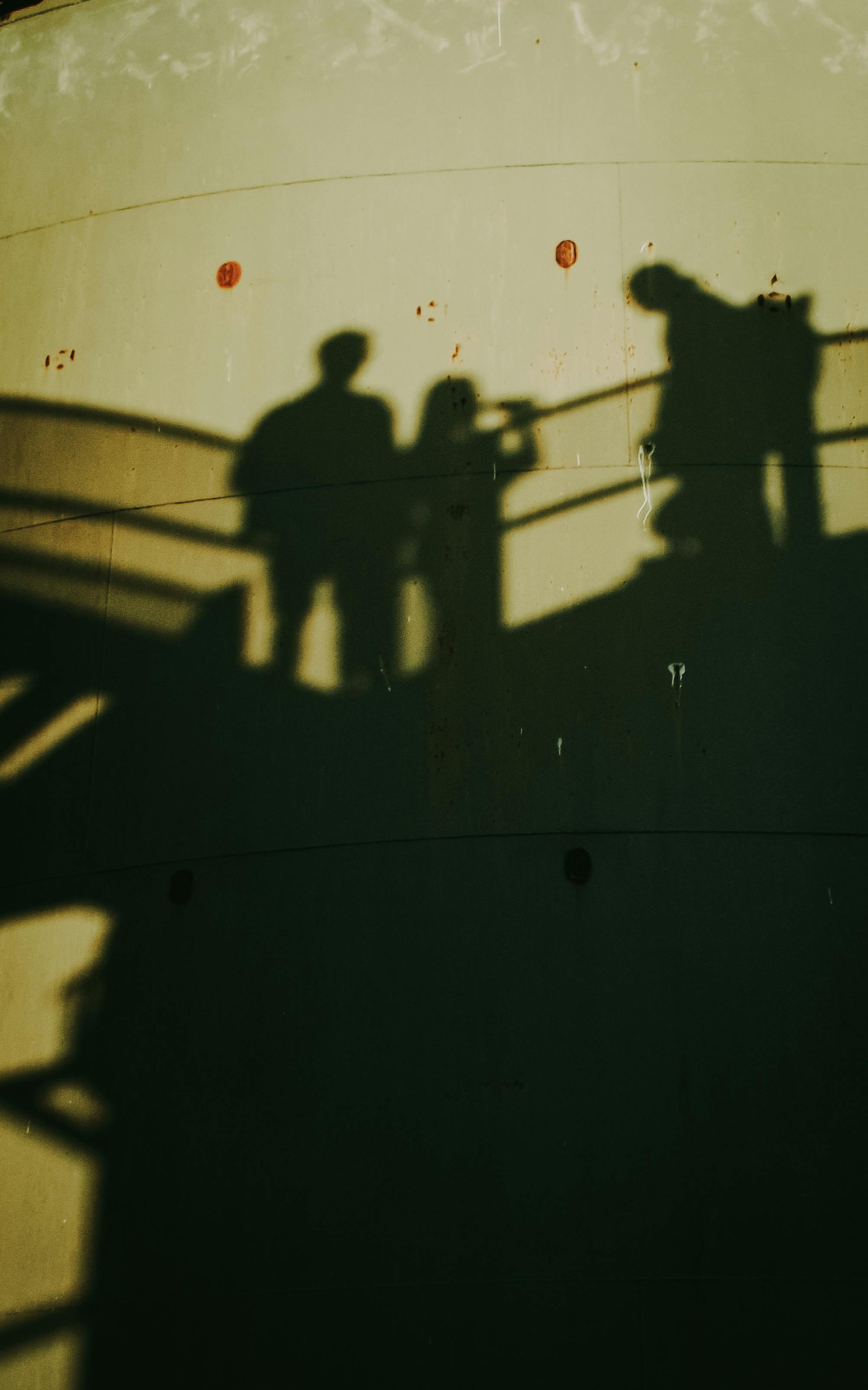 dramatic shadow silhouettes on urban wall