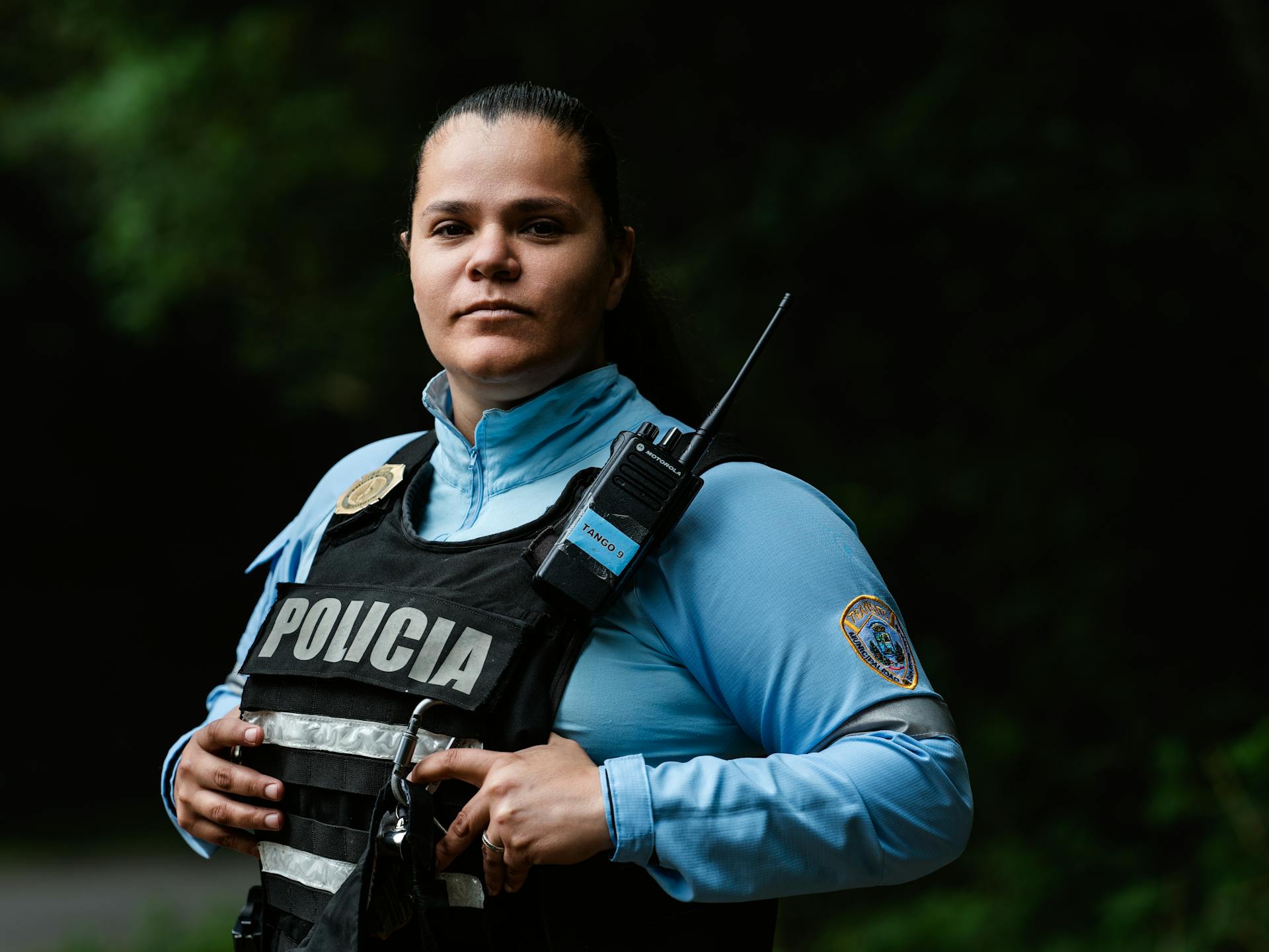 Confident Police Officer in Uniform Standing Outdoors