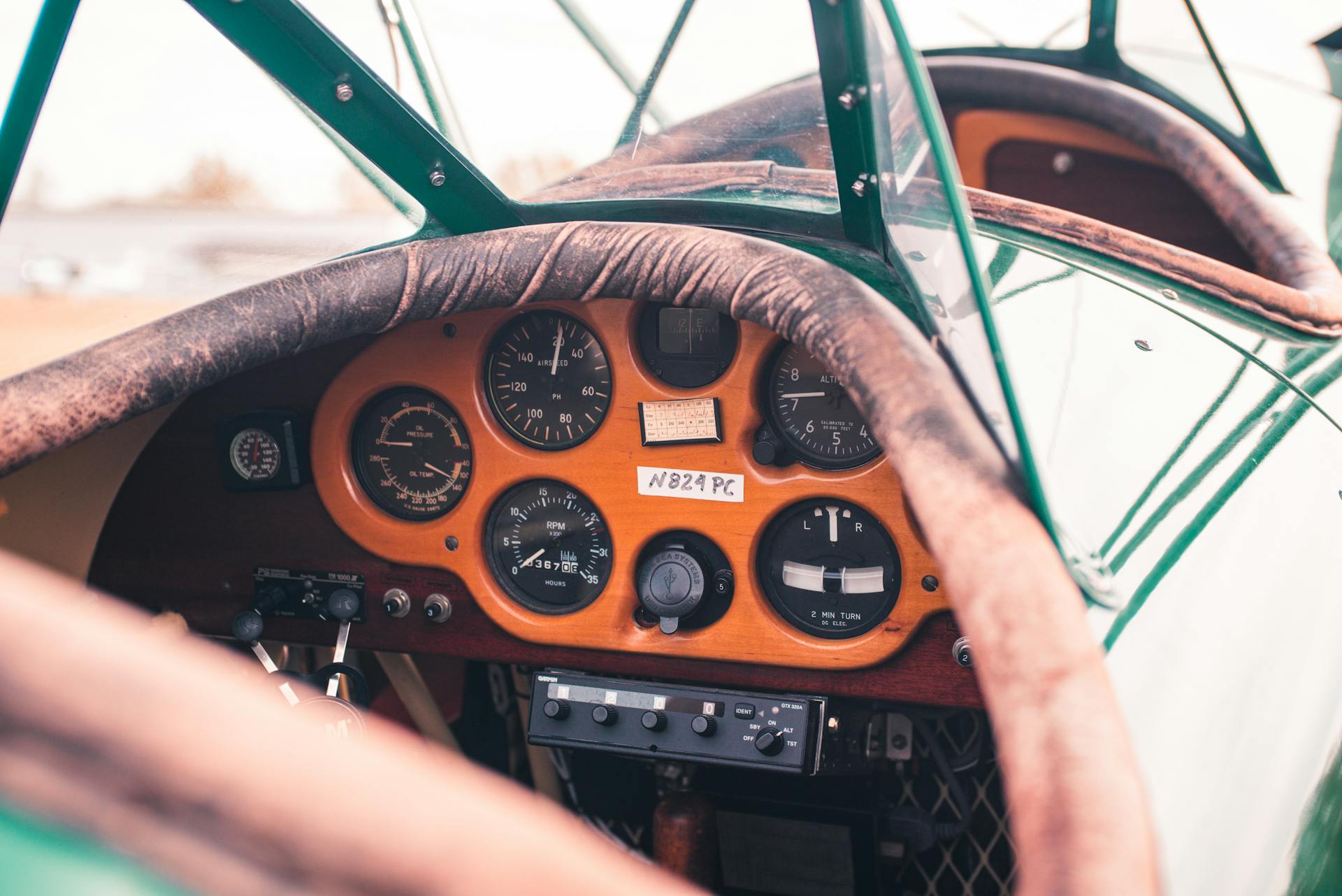 Close-up of vintage aircraft cockpit instruments in Collinsville, Oklahoma