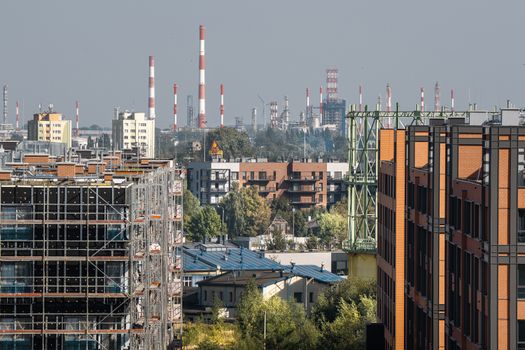 Cityscape featuring development and industrial chimneys in Gdansk.