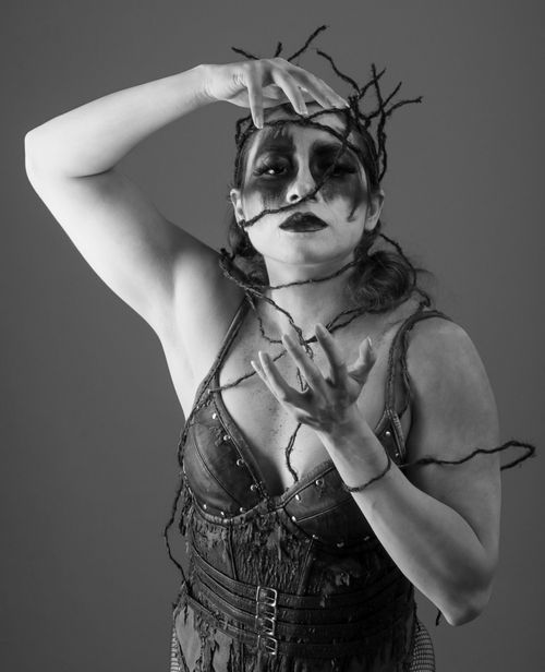 Free Expressive black and white portrait with dark artistic makeup and creative styling. Stock Photo