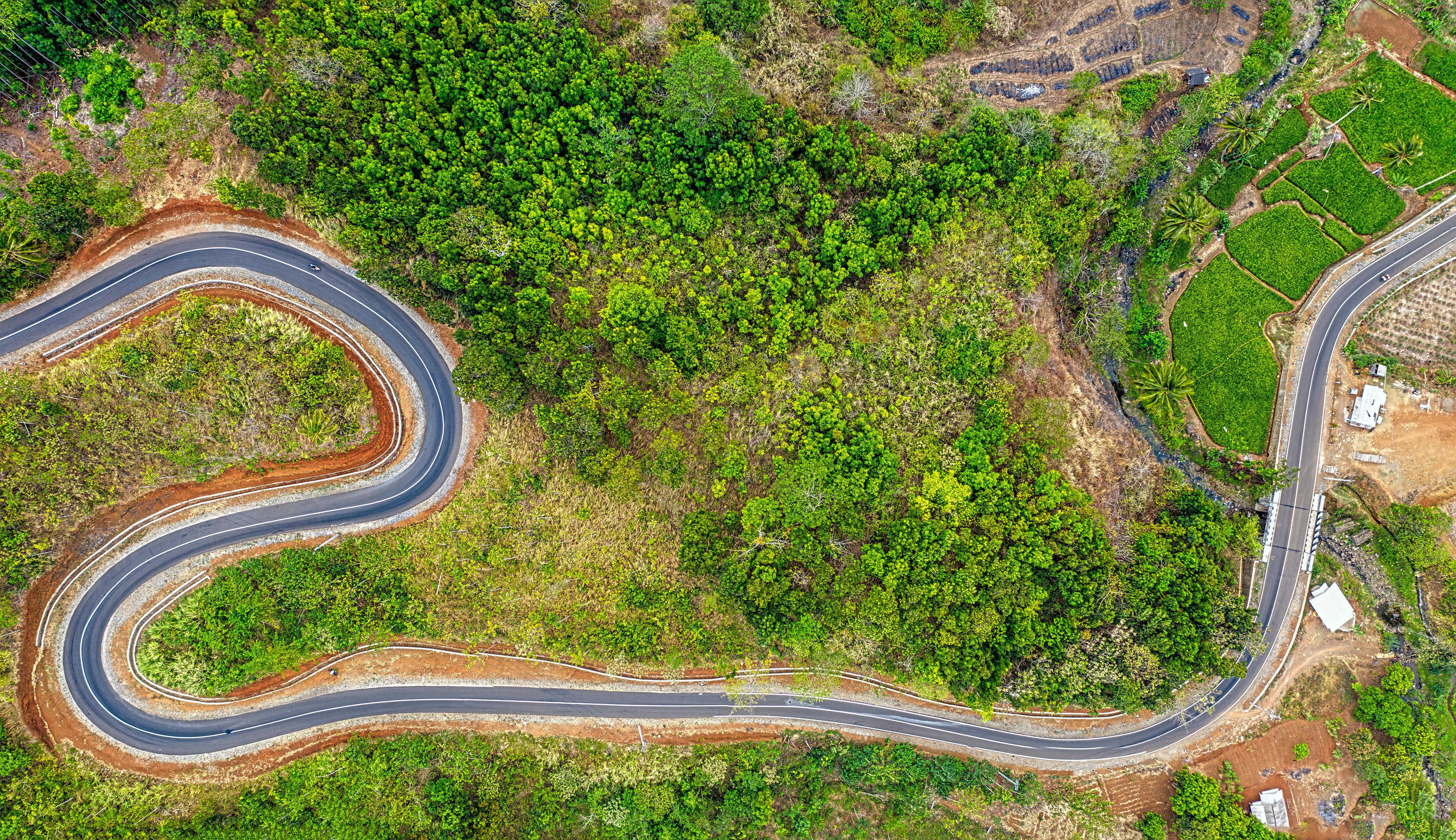 a zigzagging road in a mountain