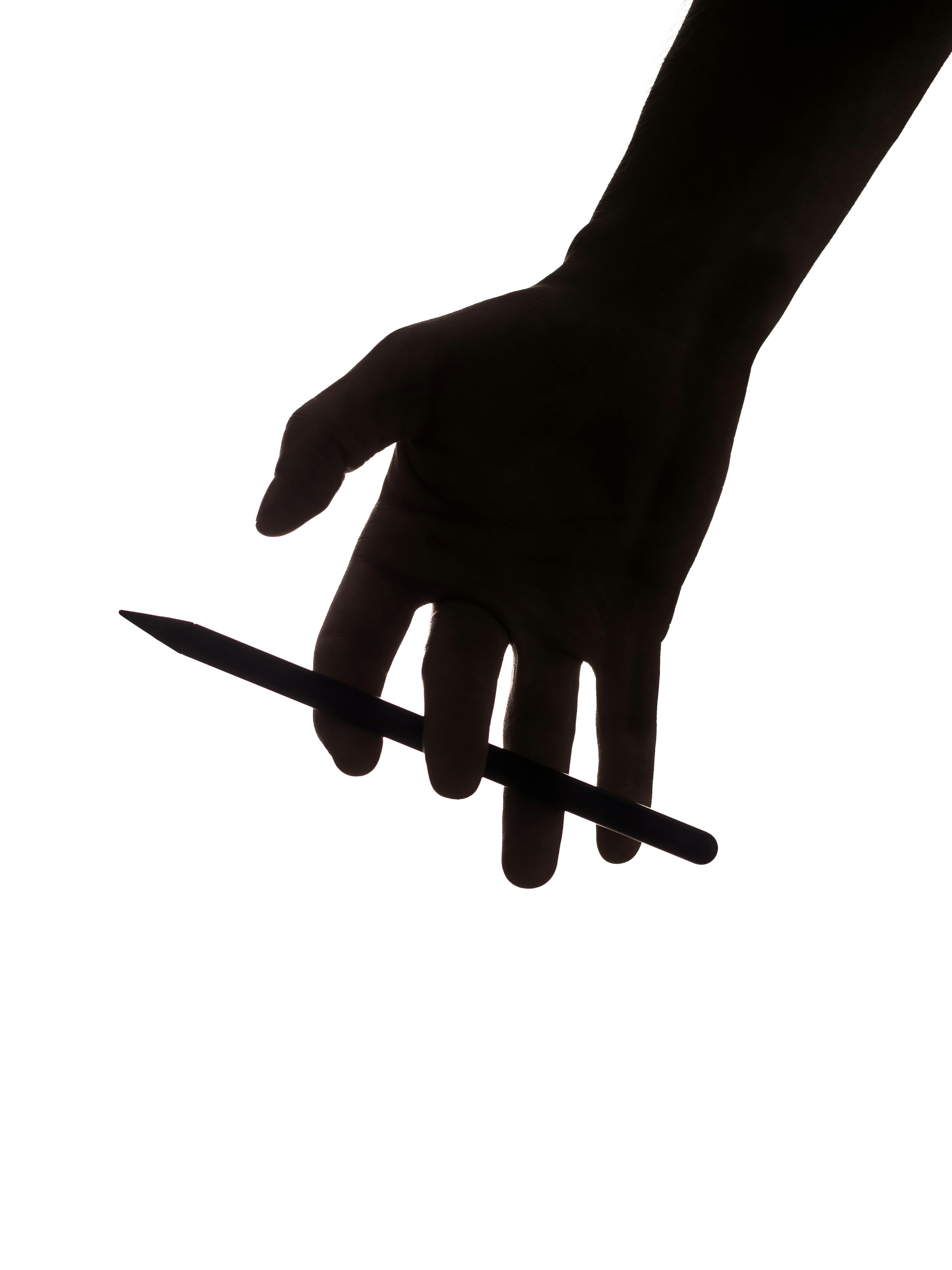 Kostenlos Silhouette Einer Hand, Die Einen Stift Hält Stock-Foto