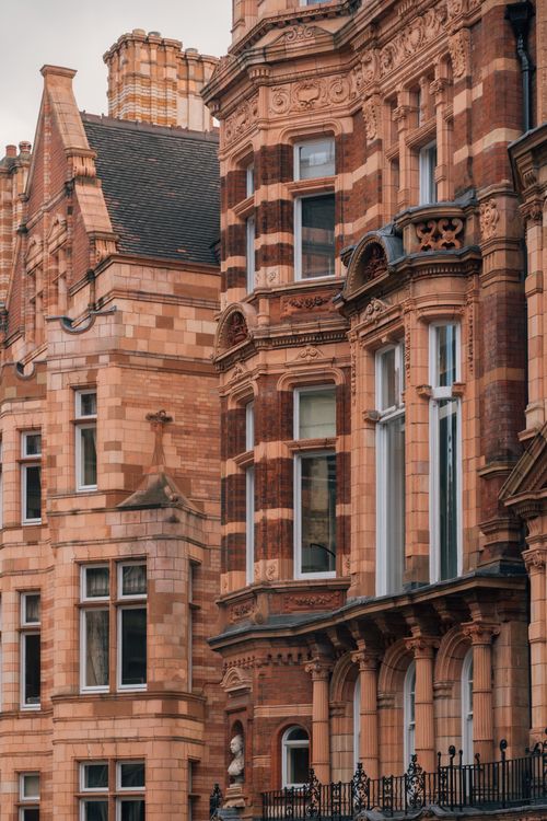 Free Detailed view of ornate Victorian architecture in an urban environment. Stock Photo