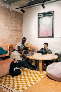 Three adults enjoying a relaxed meeting in a cozy indoor space.