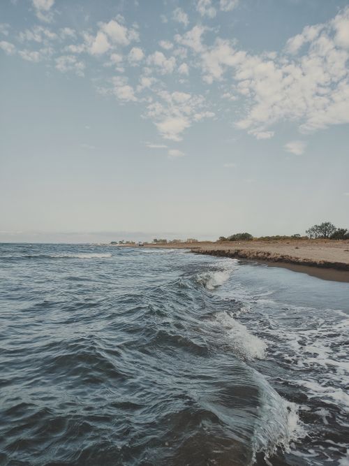 Free Peaceful beach scene at Samsun, Türkiye with calm waves and clear sky. Stock Photo