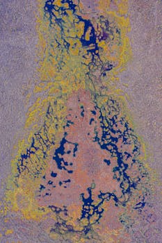 Aerial abstract view of vibrant natural patterns resembling abstract art with colorful formations.