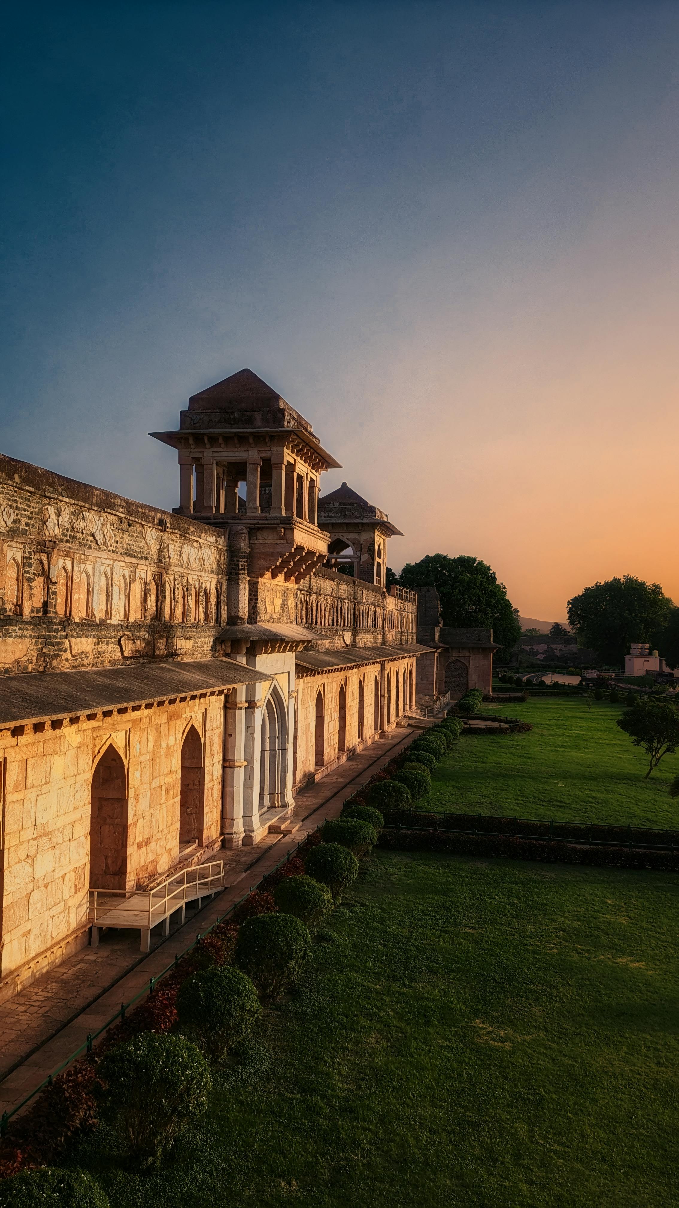 historic indian fort at sunset with lush gardens