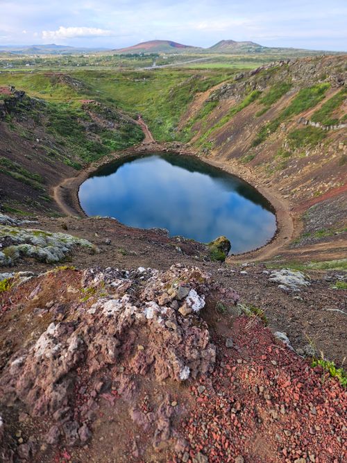 Free Explore the breathtaking beauty of the volcanic Kerið Crater Lake surrounded by lush greenery in Iceland. Stock Photo