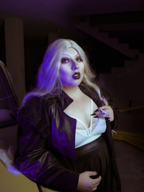 Free Woman in gothic style with striking makeup and leather jacket indoors. Stock Photo