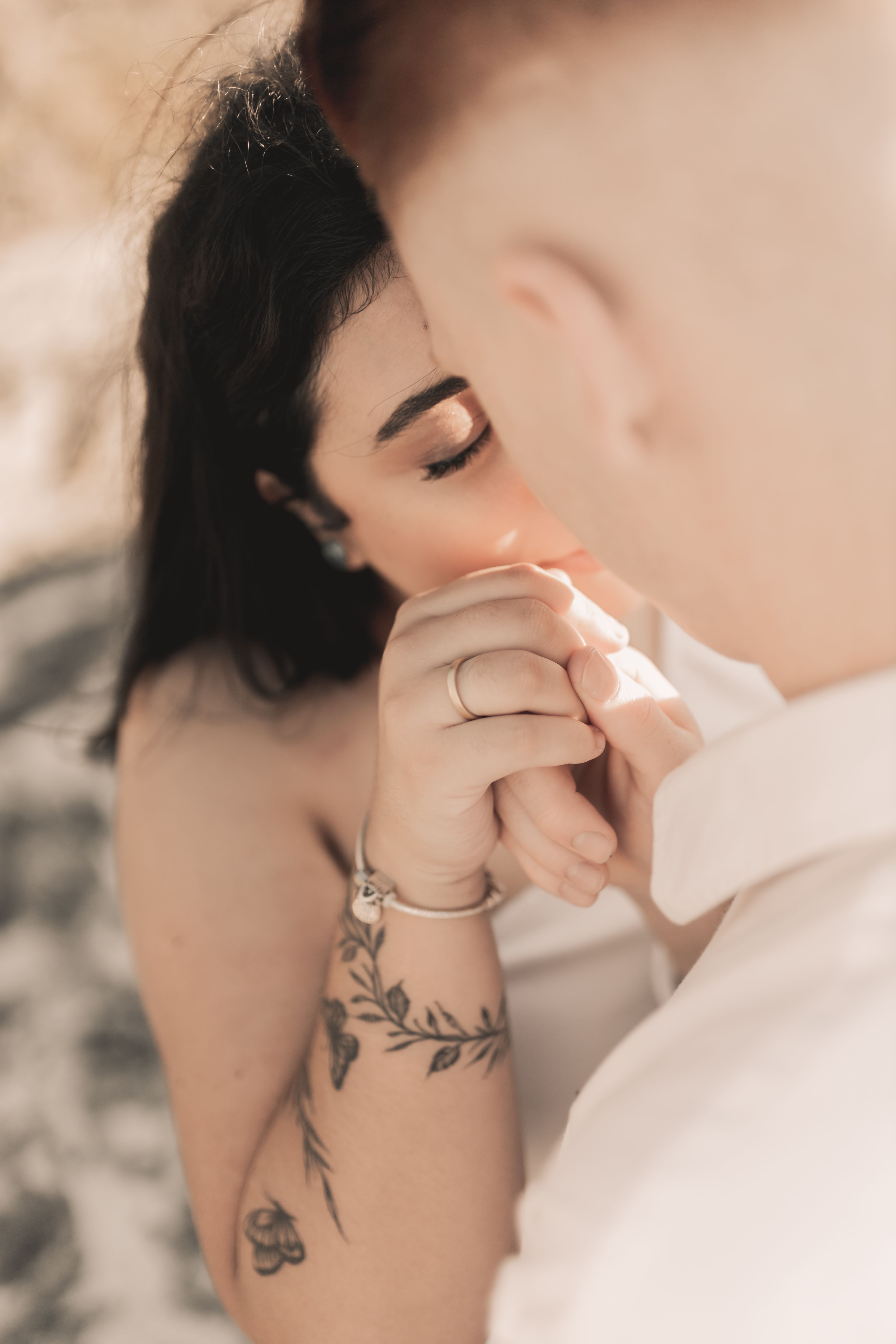 Romantic Couple Holding Hands Outdoors · Free Stock Photo