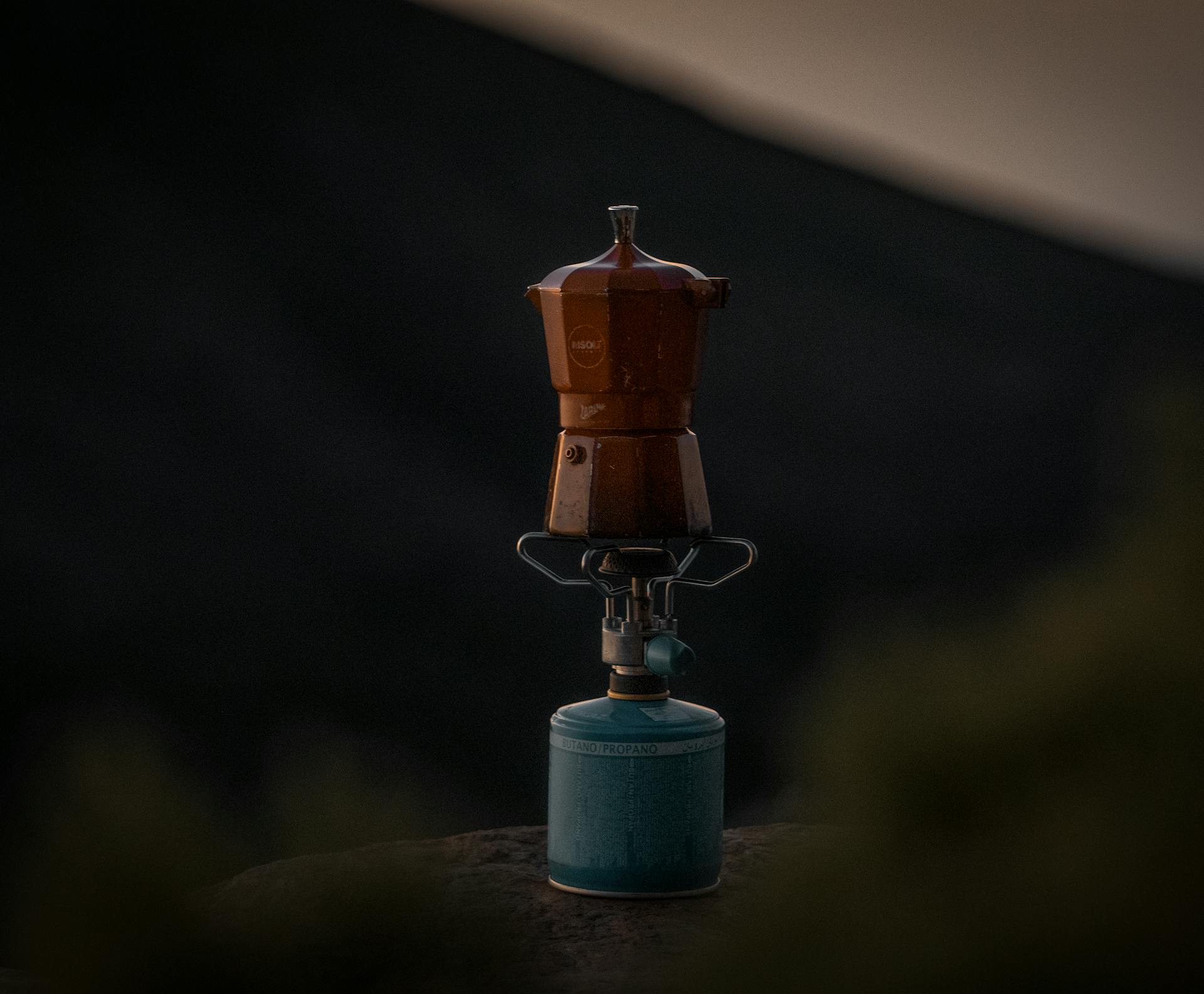 Brass-colored Pot On A Gas Burner