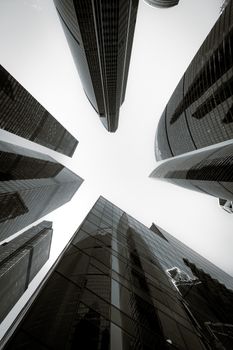 Upward view of modern skyscrapers in Moscow, capturing architecture and urban design.