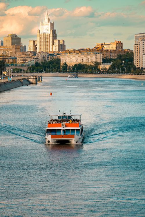Free A ferry boat cruising on Moscow River with iconic city view on a clear day. Stock Photo