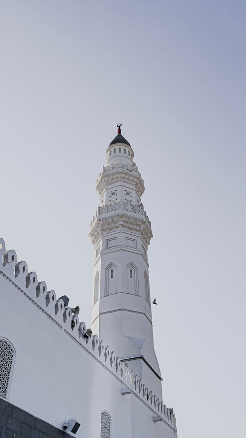 Free Striking view of a mosque minaret under a clear blue sky in Madinah, Saudi Arabia. Stock Photo