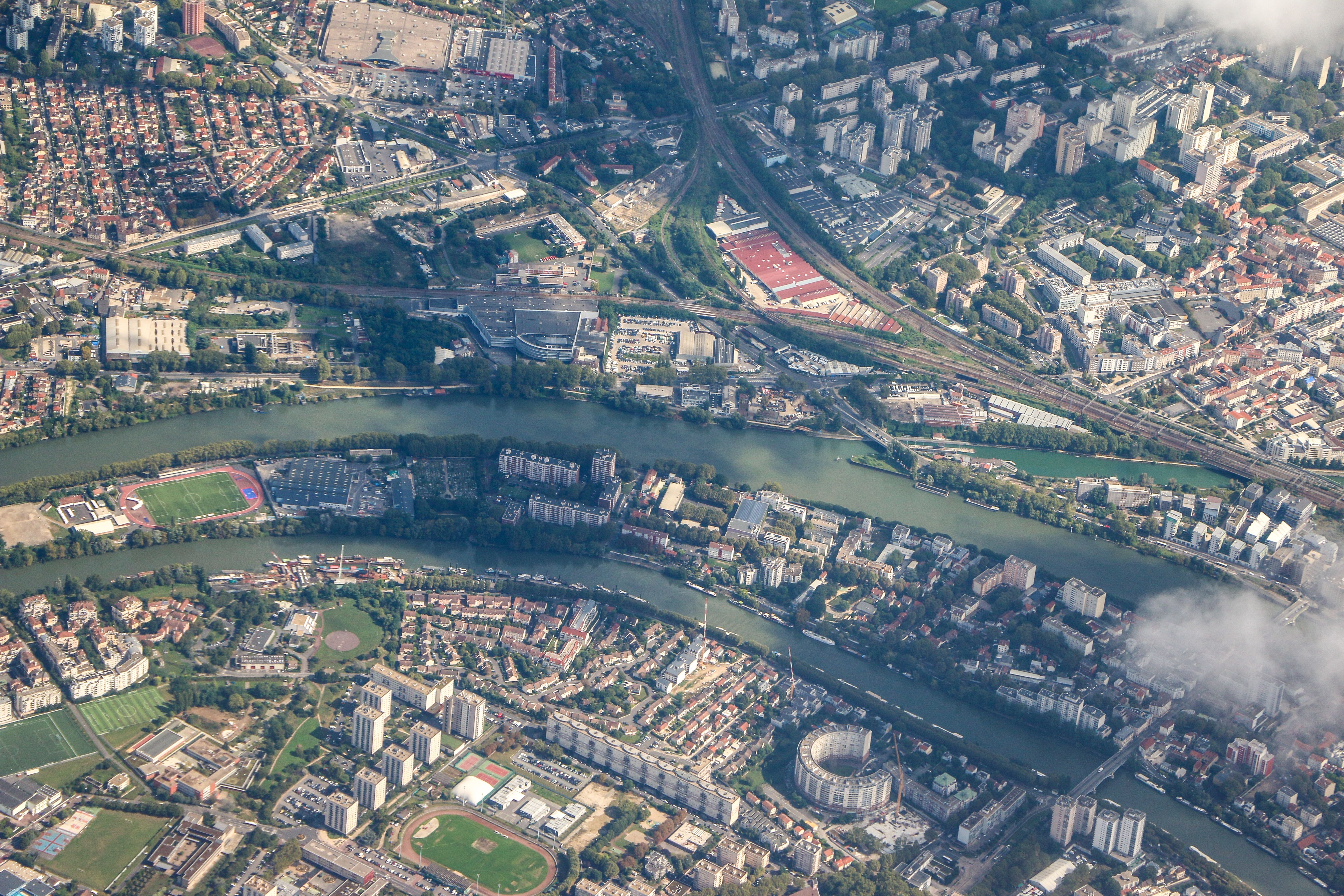 Aerial View of Urban Landscape with River and Buildings · Free Stock Photo