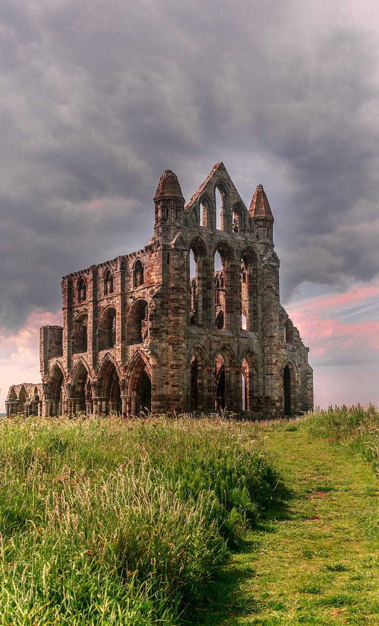 Photo Of Old Church Building Under Cloudy Sky