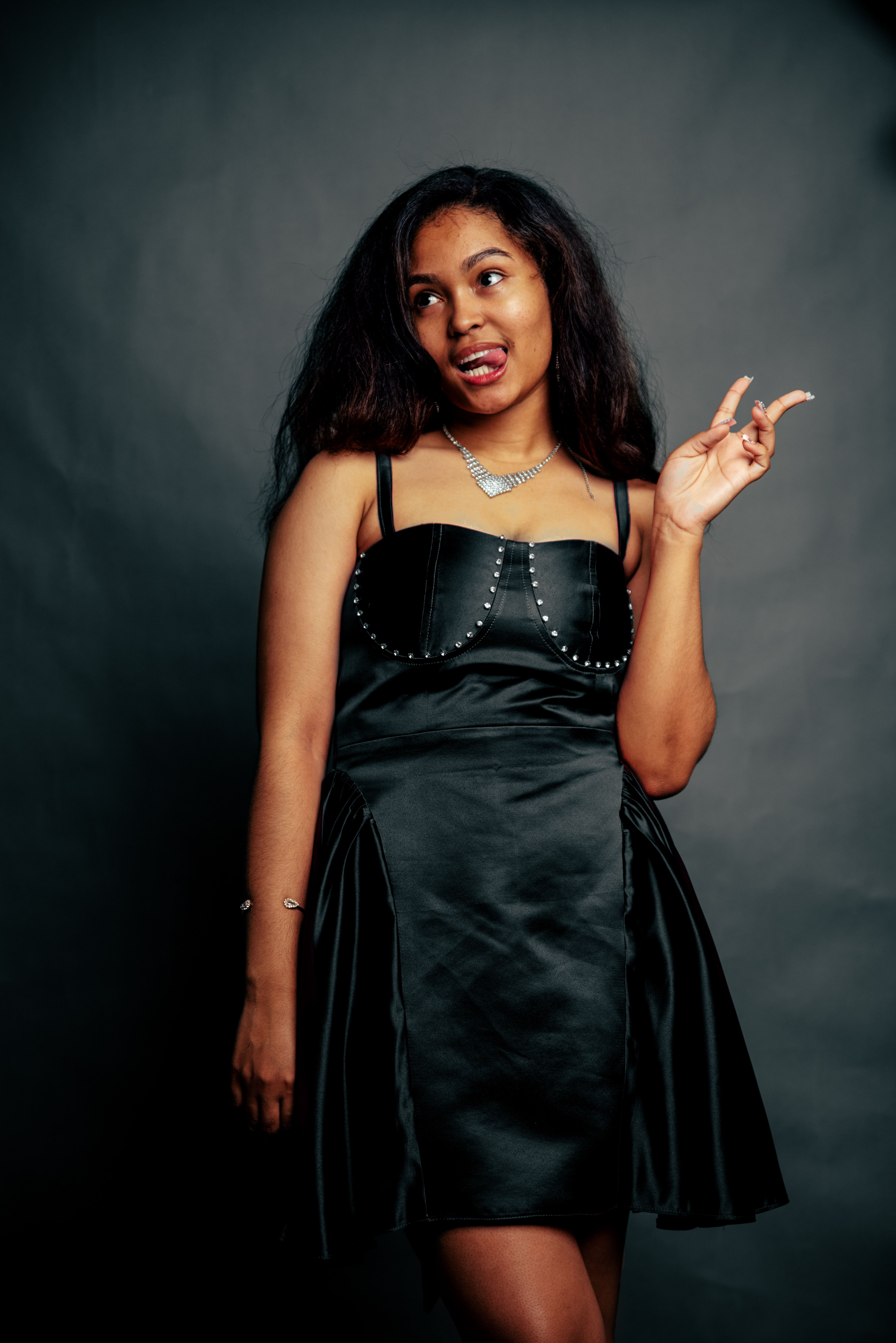 Elegant Woman in Black Dress Studio Portrait · Free Stock Photo