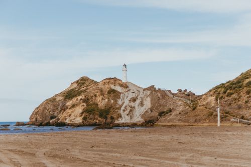 Free Beautiful view of Castlepoint lighthouse and beach on New Zealand's North Island. Stock Photo