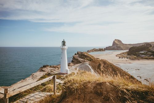 Free Explore the scenic beauty of Castlepoint Lighthouse on the North Island beaches. Stock Photo
