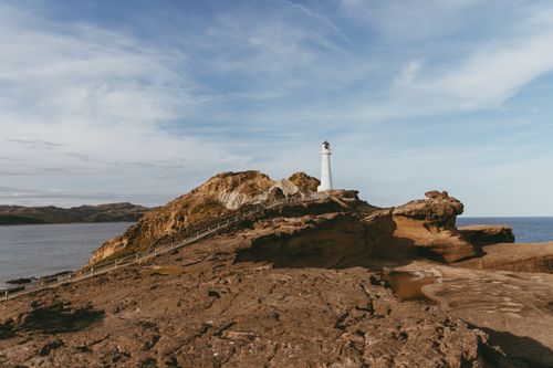 Free Explore Castlepoint's dramatic cliffs and iconic lighthouse on New Zealand's North Island. Stock Photo