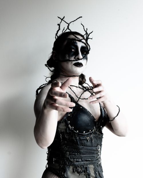 Free Striking gothic cosplay with dramatic makeup and intricate costume details creates a captivating dark vibe. Stock Photo