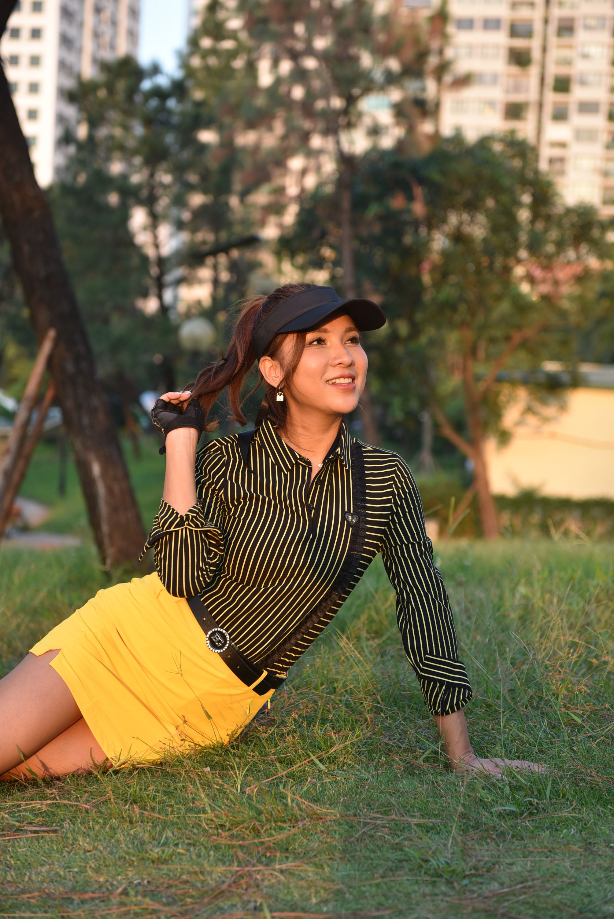Smiling Woman Posing in a Park Setting · Free Stock Photo