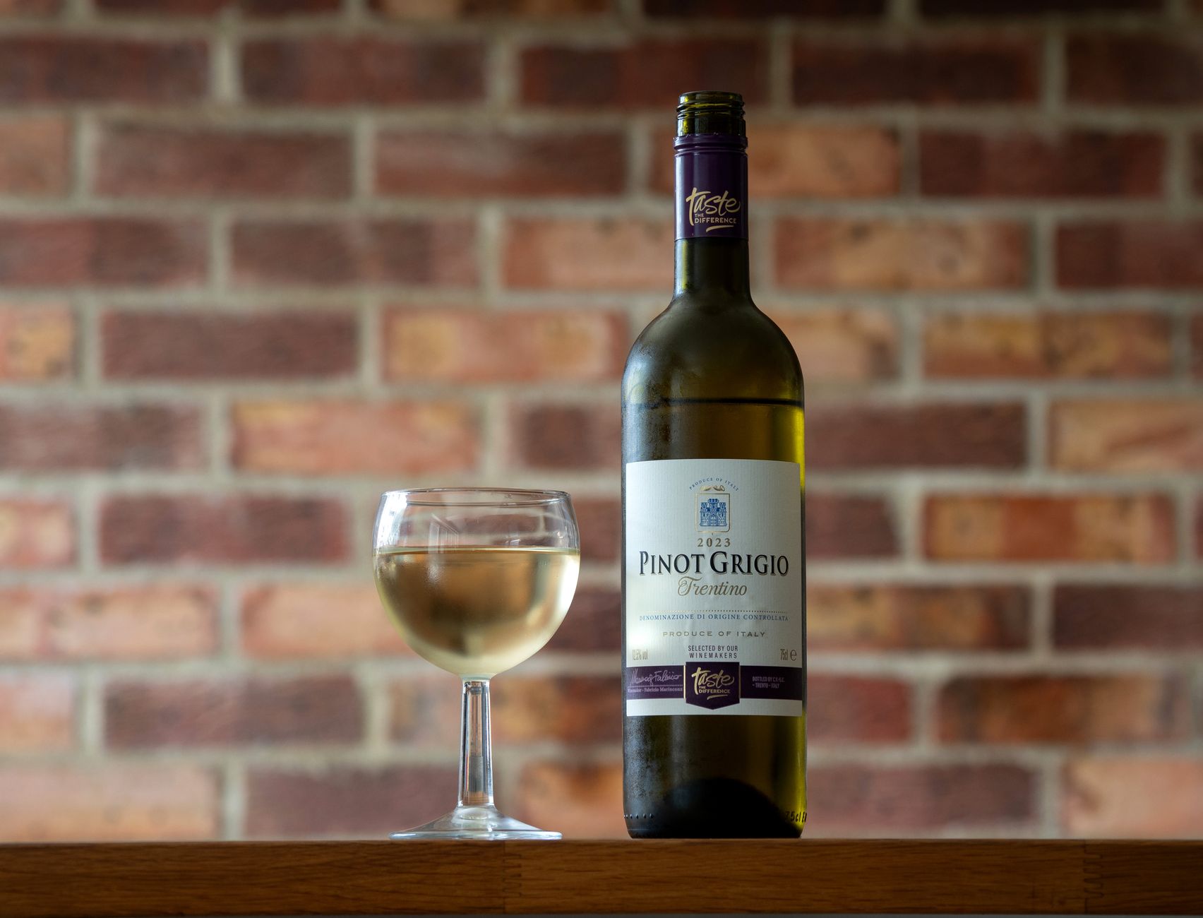 Premium Pinot Grigio paired with a fancy meal setting