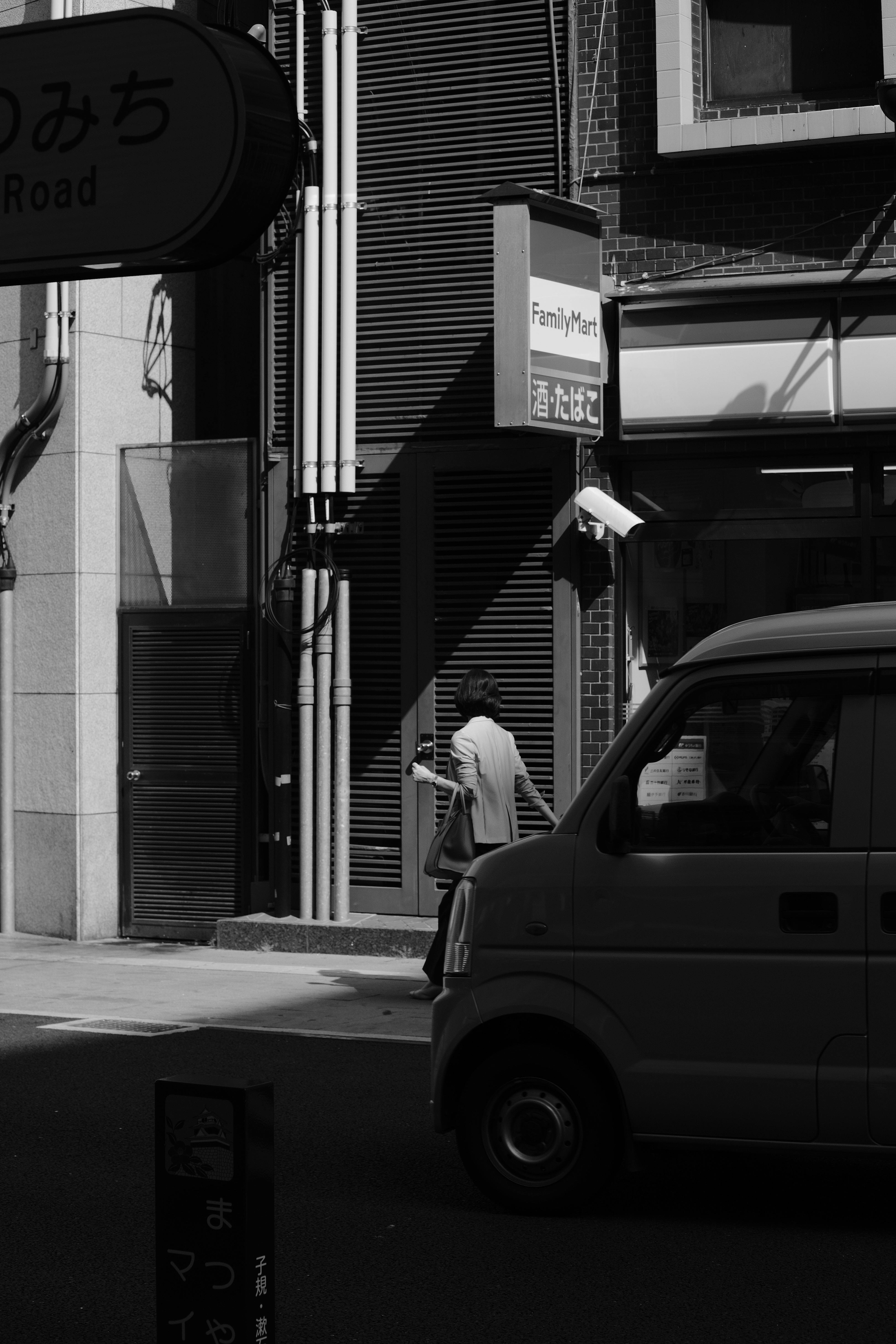 Free Black and white street photo with urban architecture and shadows. Stock Photo