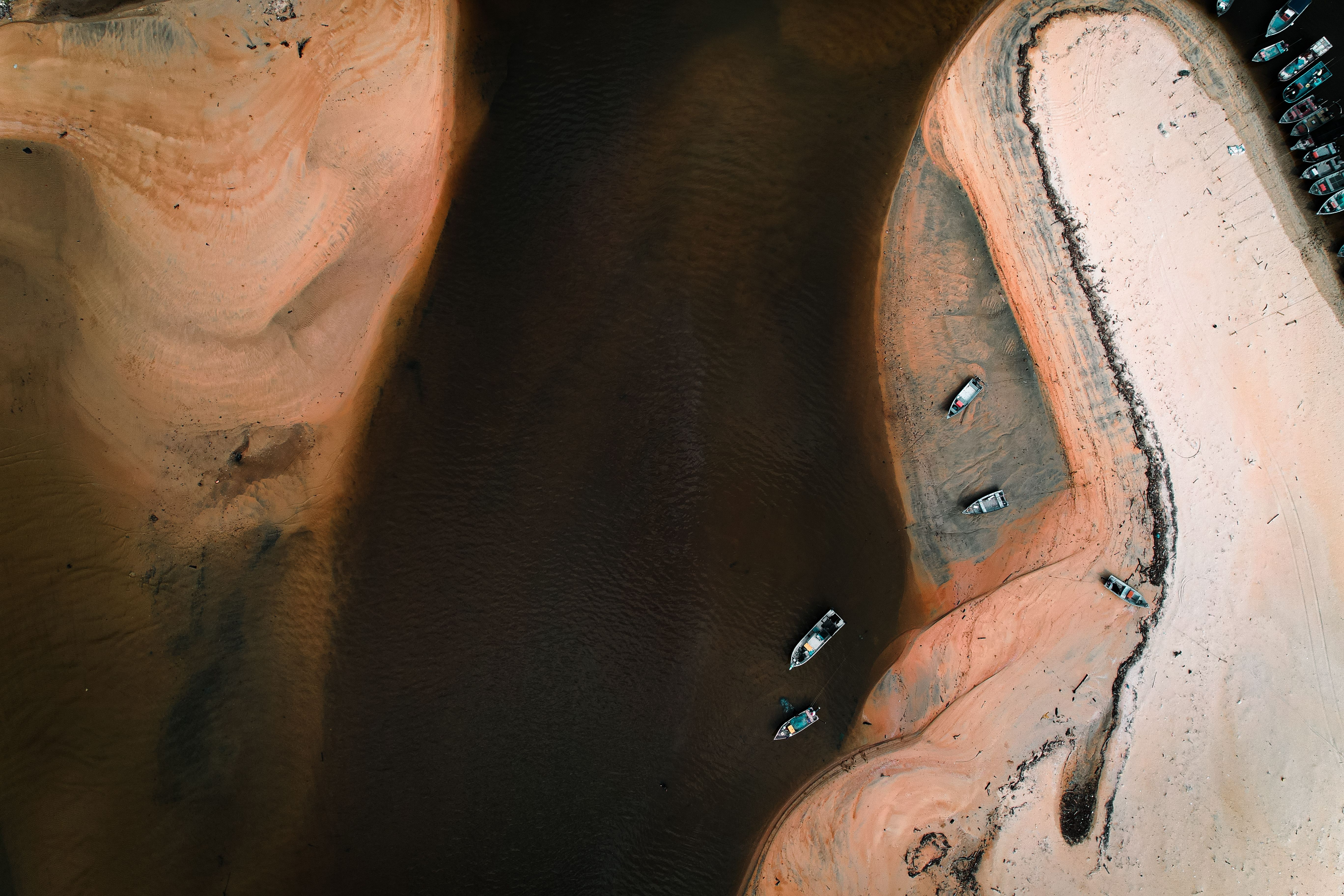 Aerial View of Boats on Sandy Beach Shoreline · Free Stock Photo