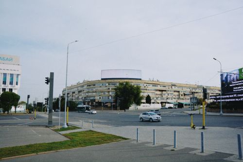 Free City intersection in Almaty, Kazakhstan showcasing urban architecture and traffic. Stock Photo