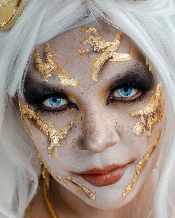 Dramatic Face Art with Gold and Blue Eyes · Free Stock Photo