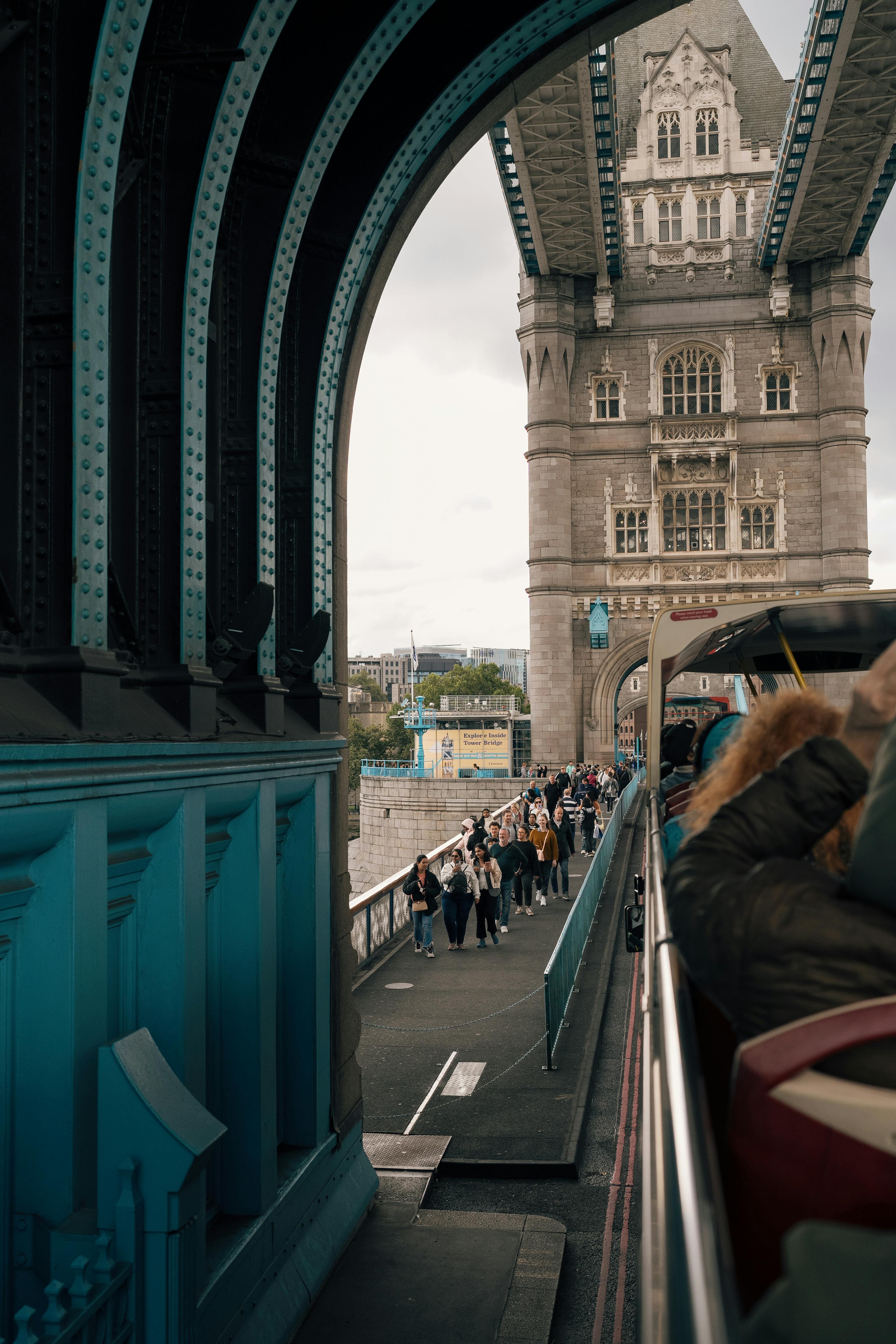 iconic tower bridge view with tourists on bus