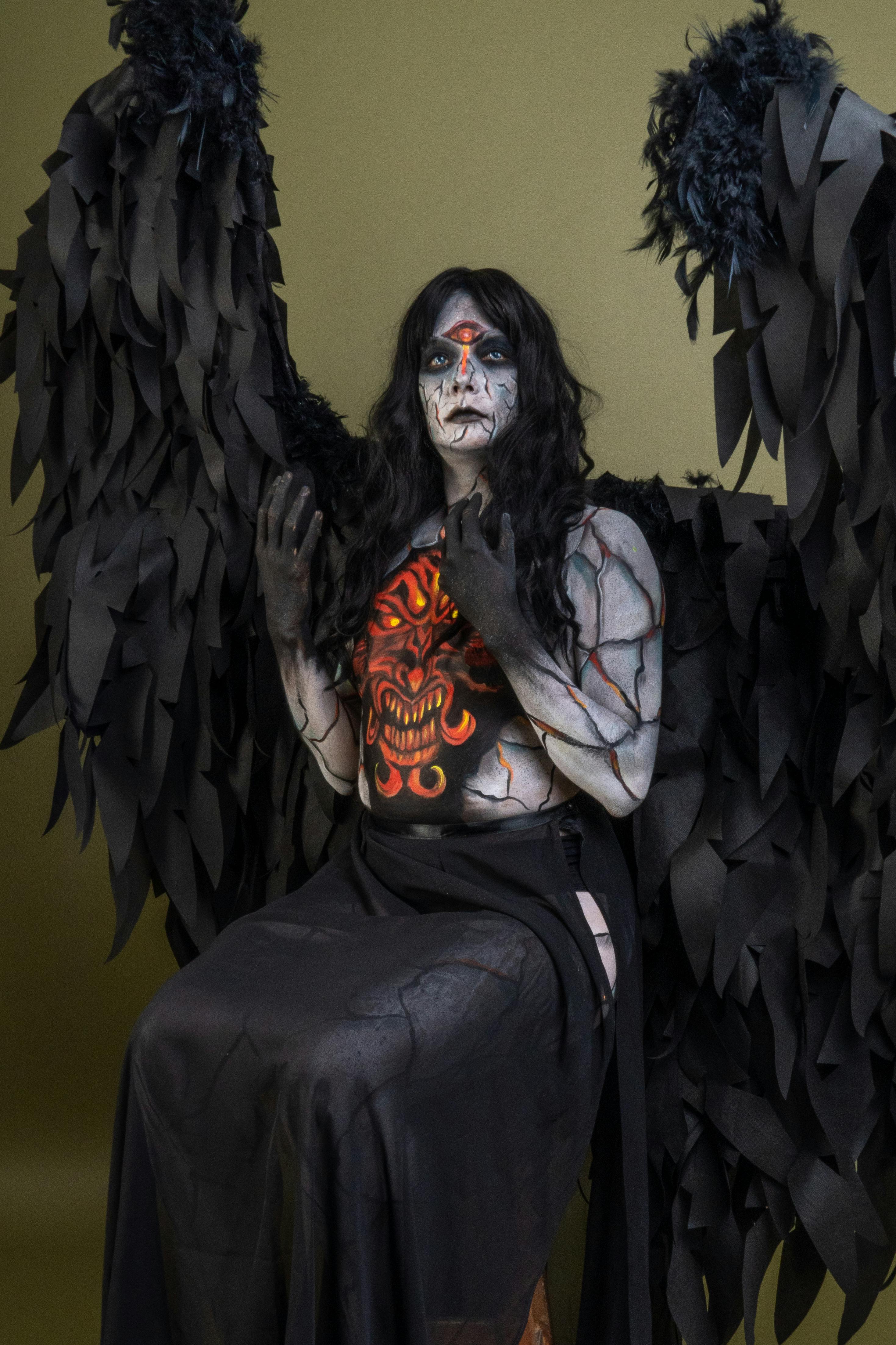 Free A captivating dark angel cosplay with dramatic makeup and costume. Perfect for Halloween themes. Stock Photo